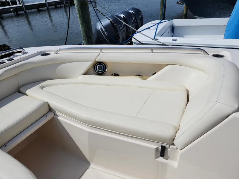 Slide: The Image of 2016 Grady-White Freedom 335 boat with cushioned seating and sleek design. - 21