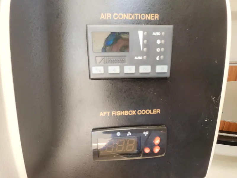 Slide: The Image of Control panel for air conditioner and aft fishbox cooler on 2016 Grady-White Freedom 335 boat. - 28