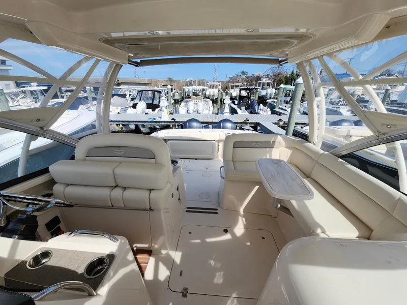 Slide: The Image of Interior view of 2016 Grady-White Freedom 335 boat, featuring spacious seating and modern design. - 9