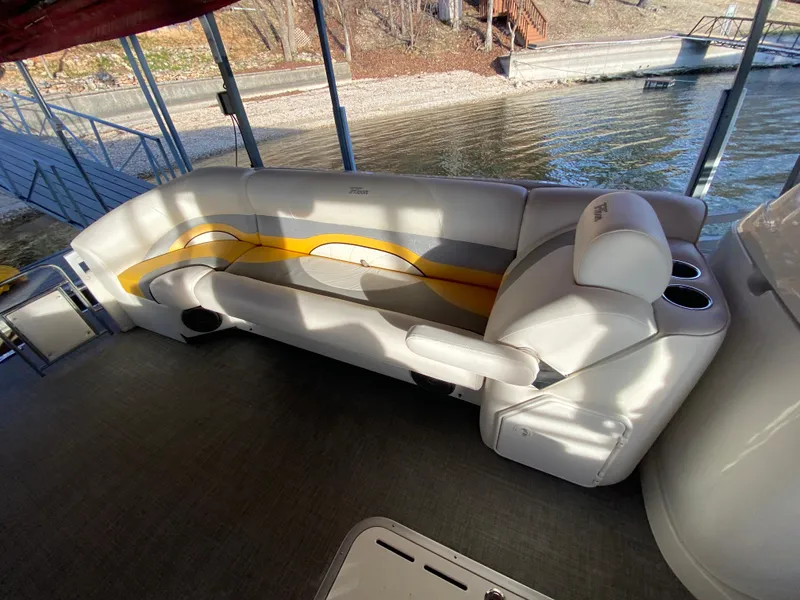 Slide: The Image of 2016 JC NepToon 23TT Sport pontoon boat interior with cushioned seating and cup holders. - 14