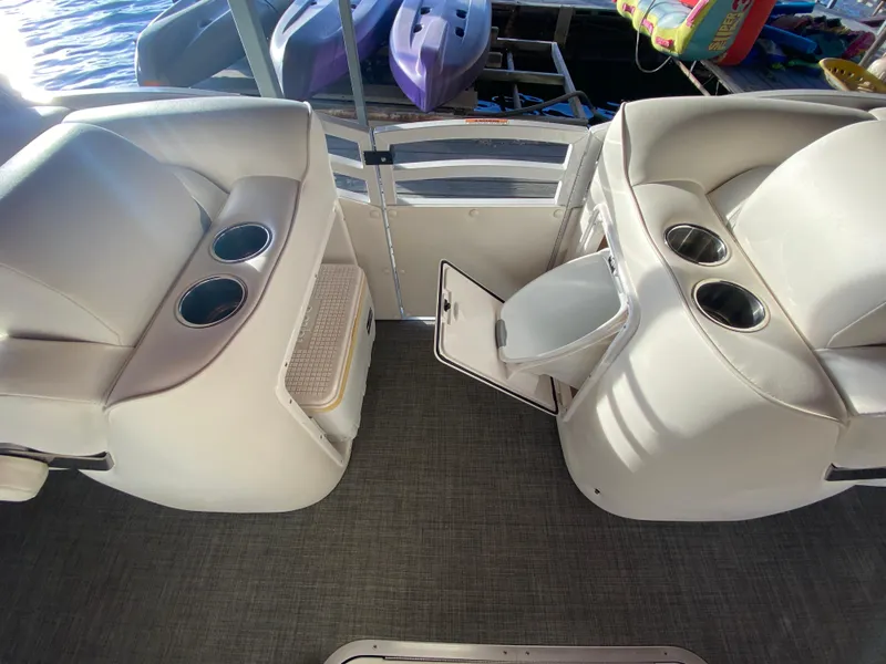 Slide: The Image of 2016 JC NepToon 23TT Sport boat interior with seating and cup holders. - 16