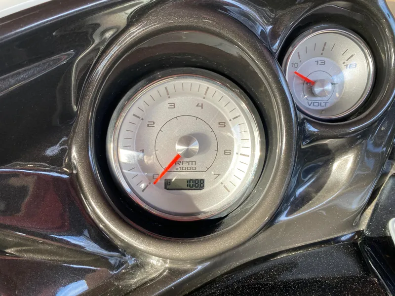 Slide: The Image of Close-up of 2016 JC NepToon 23TT Sport dashboard gauges, showing RPM and voltage. - 20