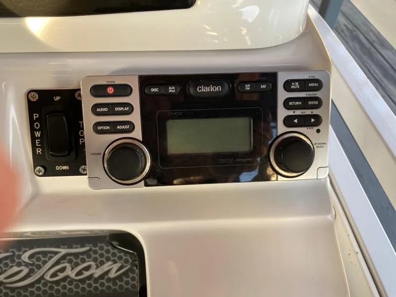 Slide: The Image of Control panel of a 2016 JC NepToon 23TT Sport with Clarion audio system. - 21