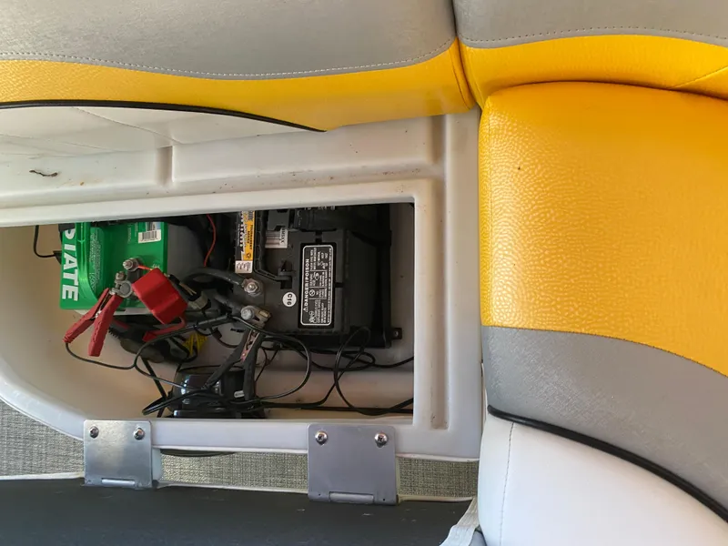 Slide: The Image of Battery compartment of 2016 JC NepToon 23TT Sport boat with yellow and gray seating. - 28