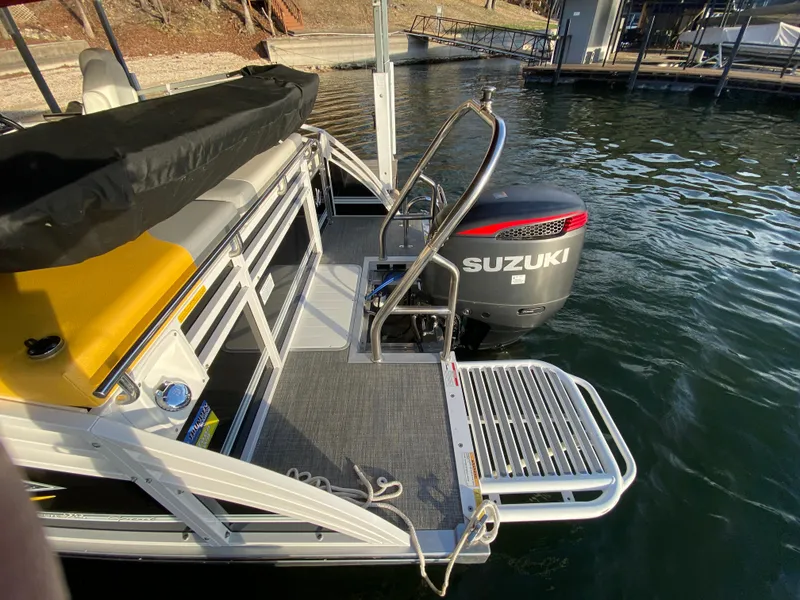 Slide: The Image of 2016 JC NepToon 23TT Sport pontoon boat with Suzuki outboard motor at dock. - 29