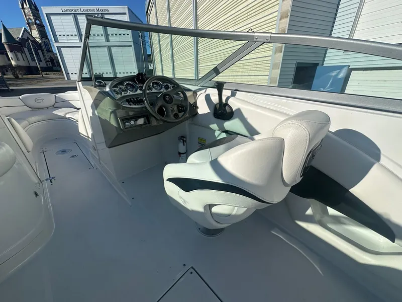 Slide: The Image of 2007 Crownline 260 LS boat interior with steering wheel and seating. - 12