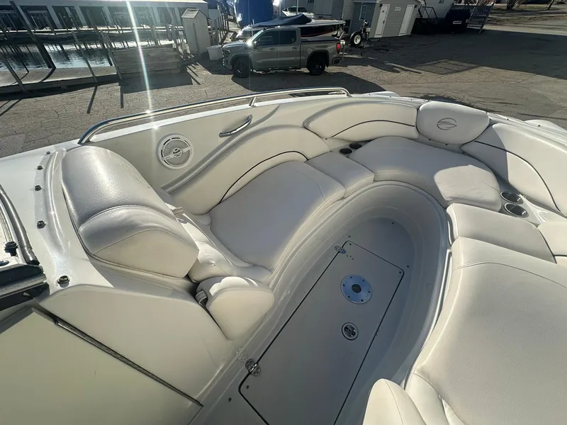 Slide: The Image of 2007 Crownline 260 LS boat with spacious white seating and sleek design. - 15