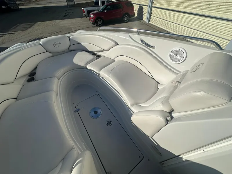 Slide: The Image of 2007 Crownline 260 LS boat interior with white leather seating and speaker. - 16