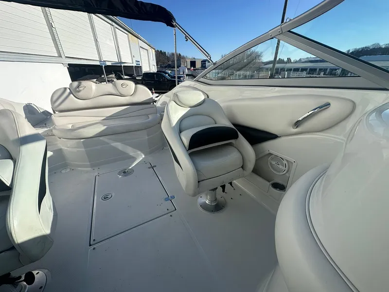 Slide: The Image of 2007 Crownline 260 LS boat interior with white seating and sleek design. - 21