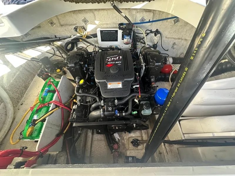 Slide: The Image of Engine compartment of a 2007 Crownline 260 LS boat, featuring a MerCruiser 350 MAG MPI engine. - 24