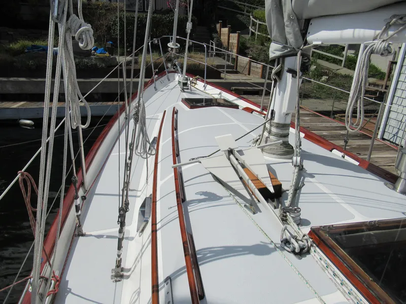 Slide: The Image of Deck view of 1980 Fast Passage 39 sailboat, showcasing rigging and clean design. - 15