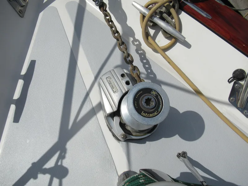 Slide: The Image of Anchor windlass on 1980 Fast Passage 39 sailboat deck. - 18