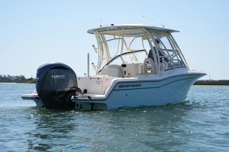 Slide: The Image of 2022 Grady-White Freedom 235 boat on water, featuring Yamaha outboard motor. - 10