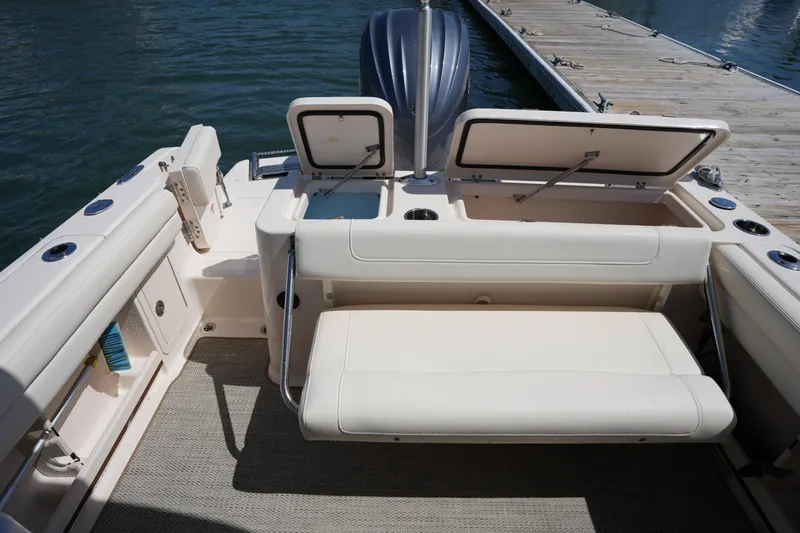 Slide: The Image of 2022 Grady-White Freedom 235 boat interior with seating and storage compartments. - 16