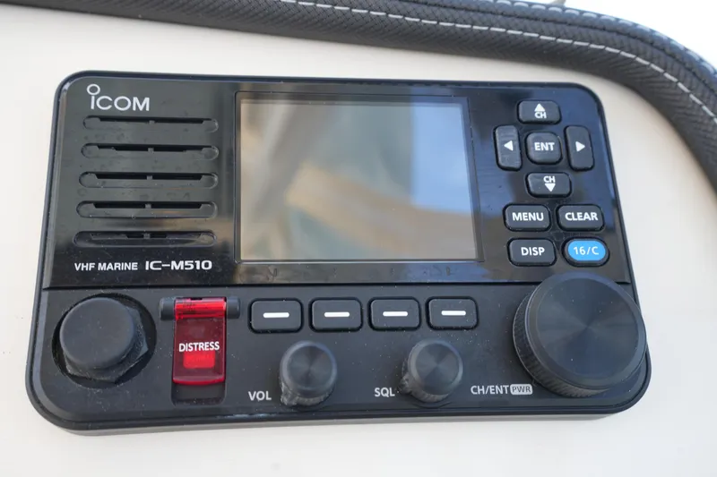 Slide: The Image of Icom VHF Marine IC-M510 radio on 2022 Grady-White Freedom 235 boat dashboard. - 26