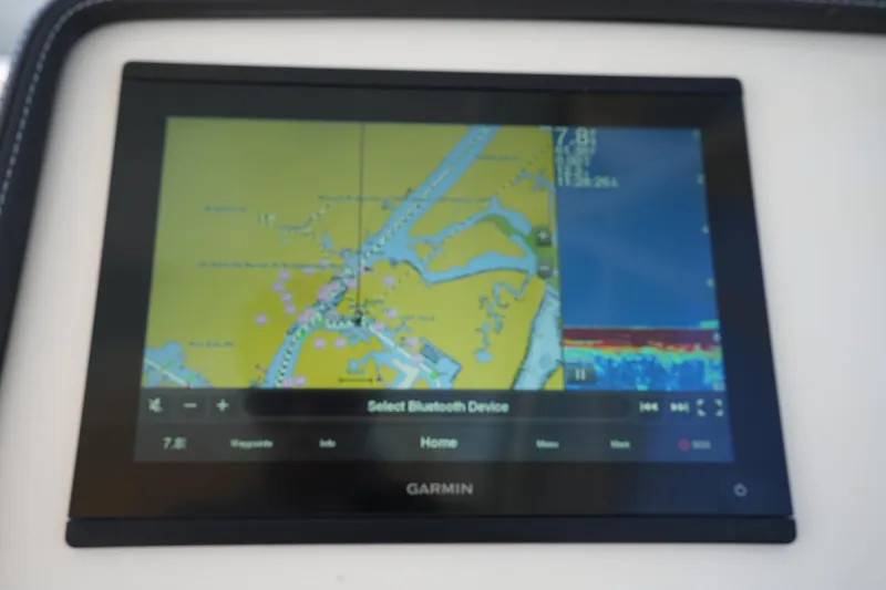 Slide: The Image of Garmin navigation display on 2022 Grady-White Freedom 235 boat dashboard. - 29