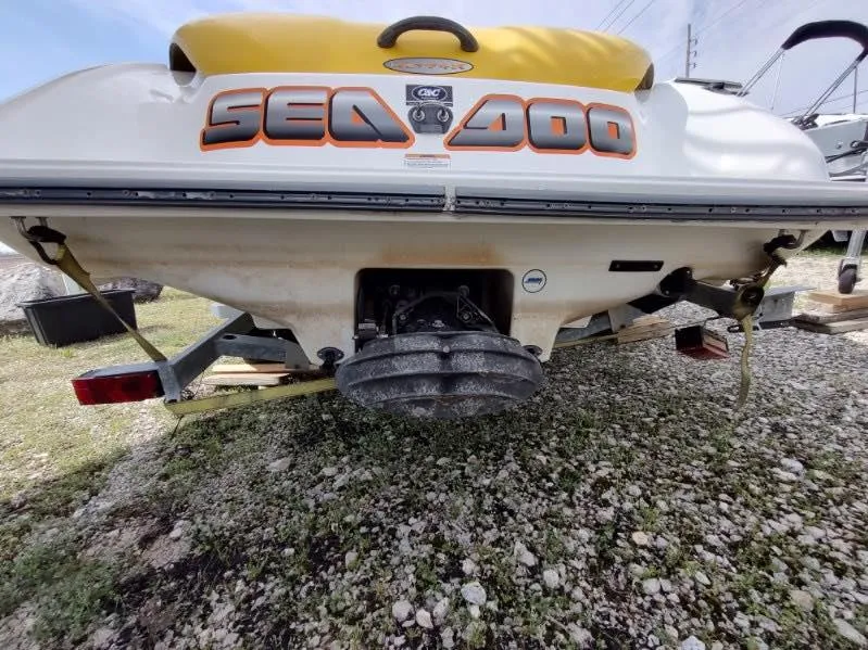 Slide: The Image of 2004 Sea-Doo Sportster boat rear view on trailer, showcasing engine and hull design. - 5