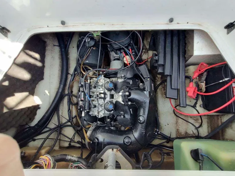 Slide: The Image of 2004 Sea-Doo Sportster engine compartment with visible wiring and components. - 7