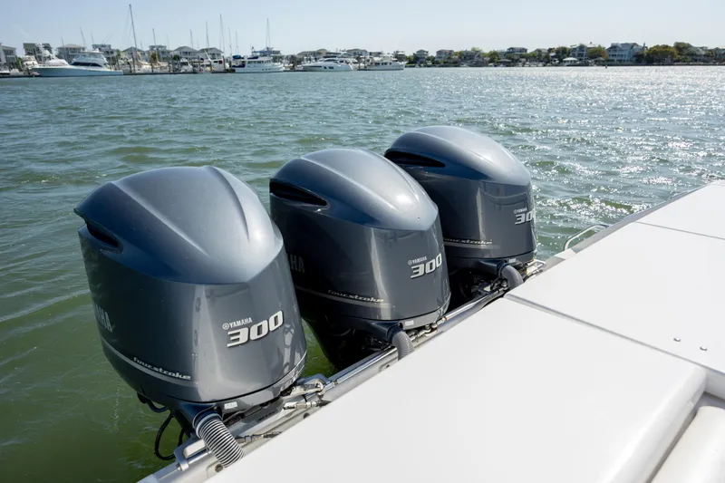 Slide: The Image of Triple Yamaha 300 engines on a 2017 Everglades 355 Tournament boat in open water. - 11