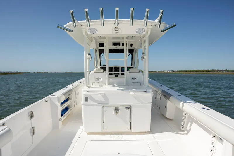 Slide: The Image of 2017 Everglades 355 Tournament boat on water, featuring spacious deck and modern design. - 13