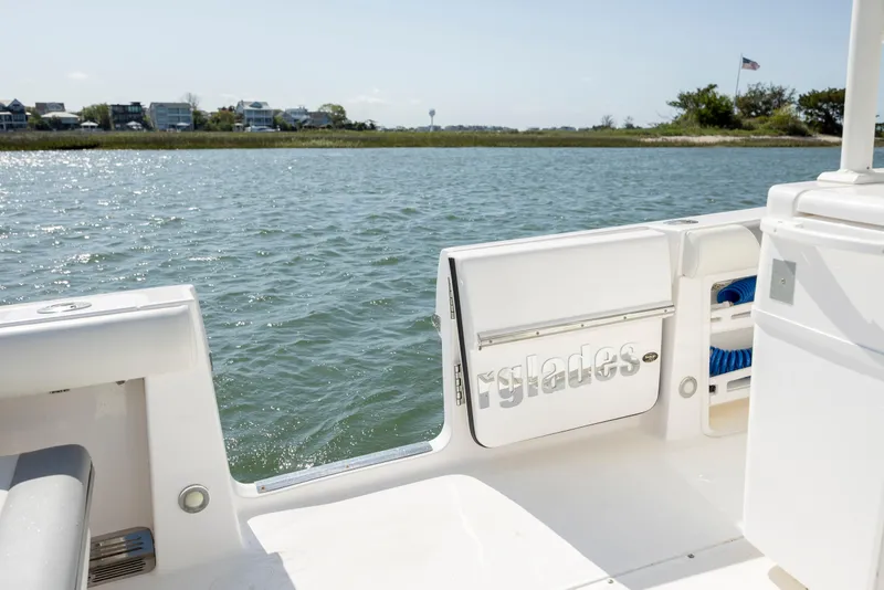 Slide: The Image of 2017 Everglades 355 Tournament boat on calm water, open side door view. - 16