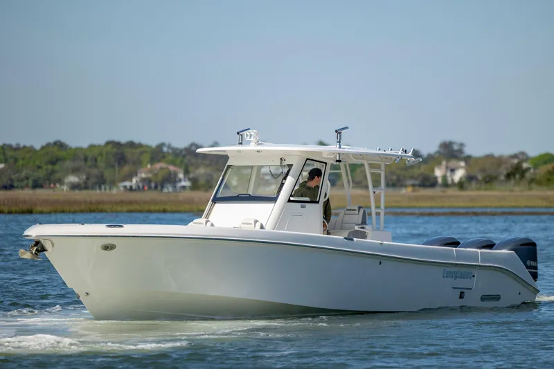 Slide: The Image of 2017 Everglades 355 Tournament boat cruising on calm water. - 2
