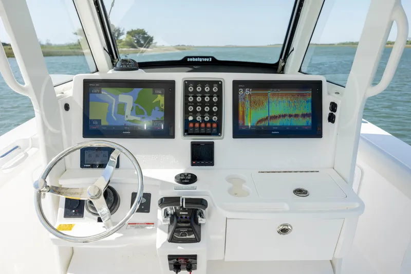 Slide: The Image of 2017 Everglades 355 Tournament boat dashboard with navigation screens and controls. - 20