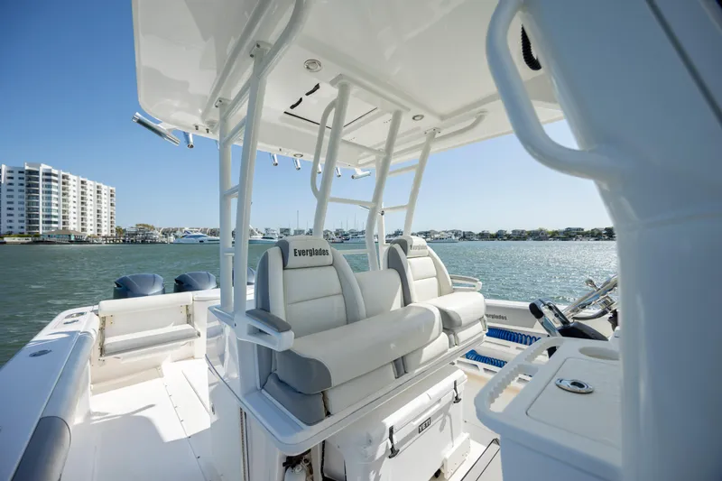 Slide: The Image of 2017 Everglades 355 Tournament boat interior with seating, overlooking waterfront buildings. - 21