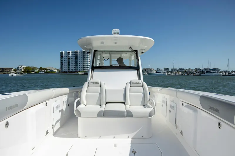 Slide: The Image of 2017 Everglades 355 Tournament boat on water, with modern seating and coastal backdrop. - 23