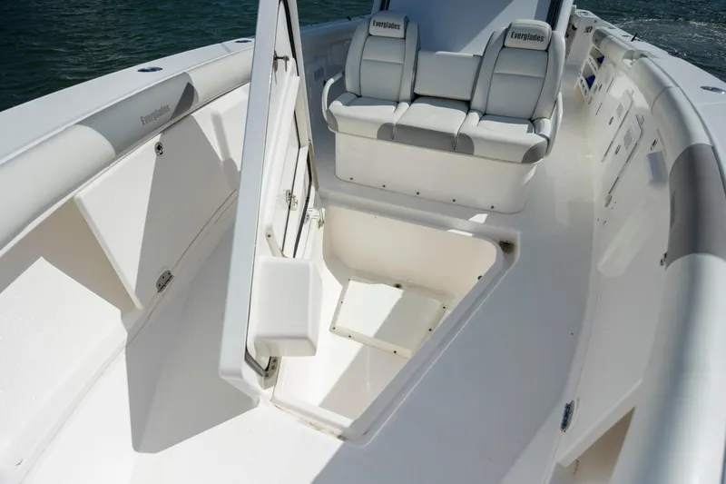 Slide: The Image of 2017 Everglades 355 Tournament boat interior with seating and storage compartments. - 25