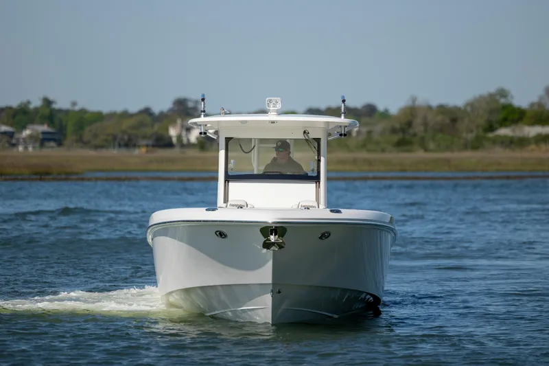 Slide: The Image of 2017 Everglades 355 Tournament boat cruising on a calm lake. - 4