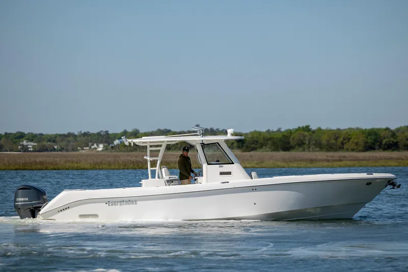 Slide: The Image of 2017 Everglades 355 Tournament boat cruising on a calm lake. - 7