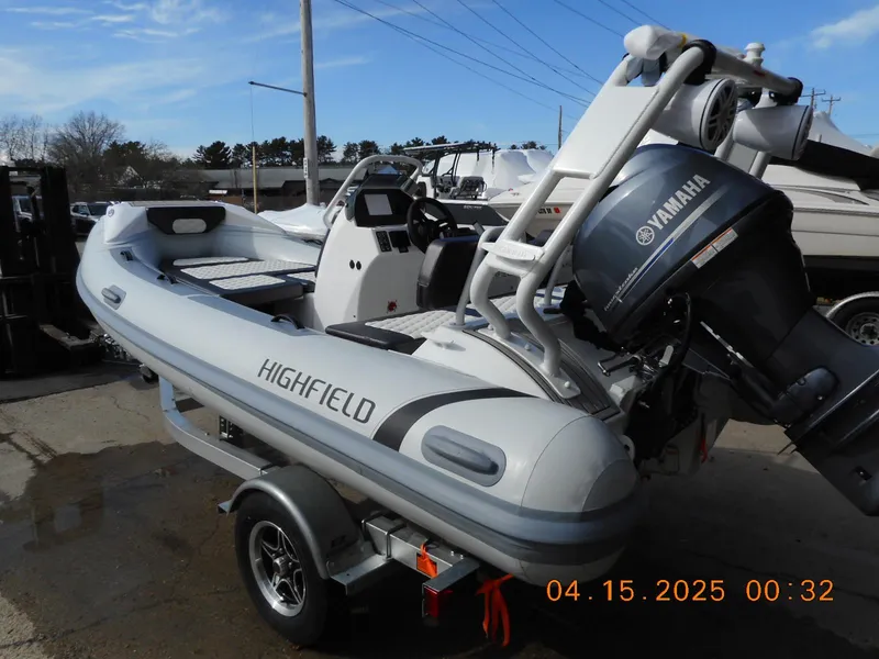 The Image of 2025 Highfield Sport 420 boat with Yamaha engine on a trailer. - 1