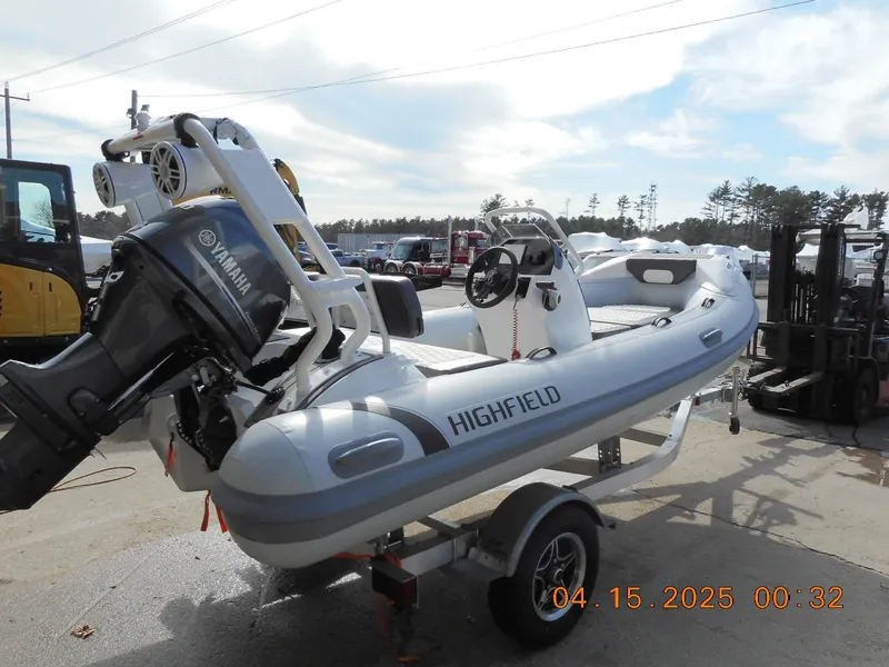 Slide: The Image of 2025 Highfield Sport 420 boat with Yamaha engine on trailer, outdoor setting. - 4