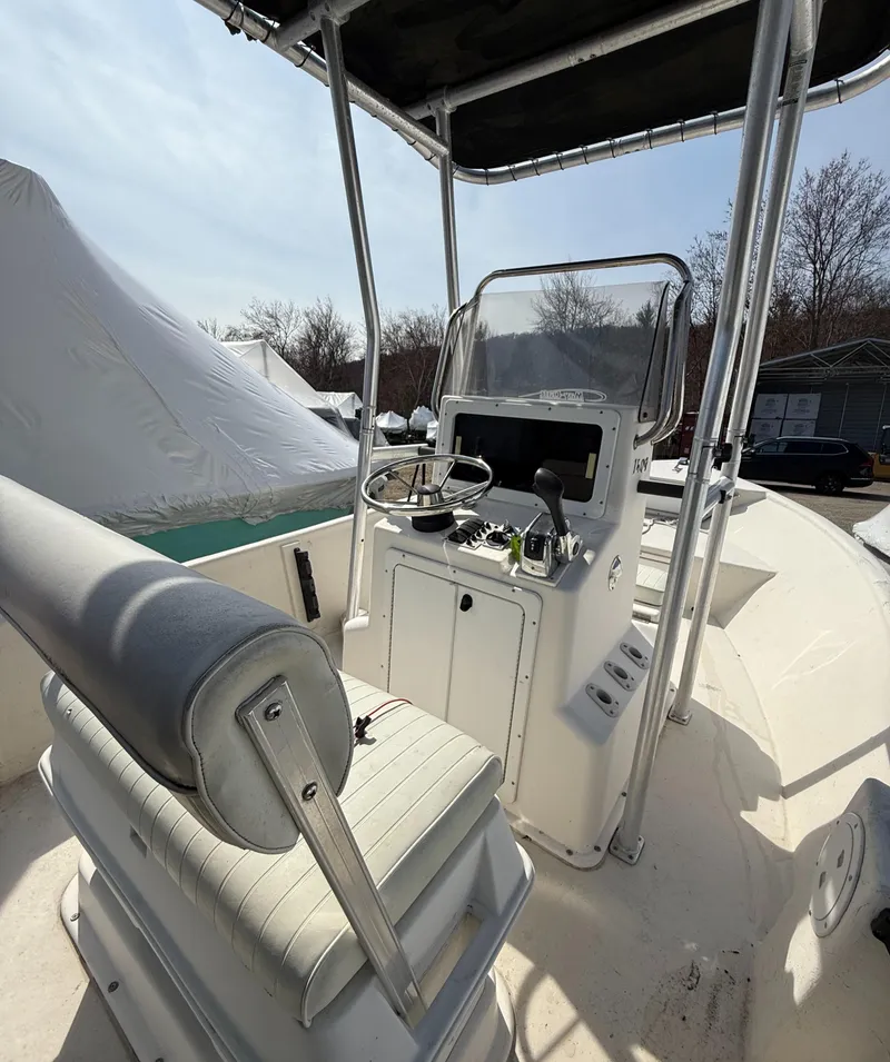 Slide: The Image of 2010 May-Craft 1800 Skiff boat interior with console and seating. - 6