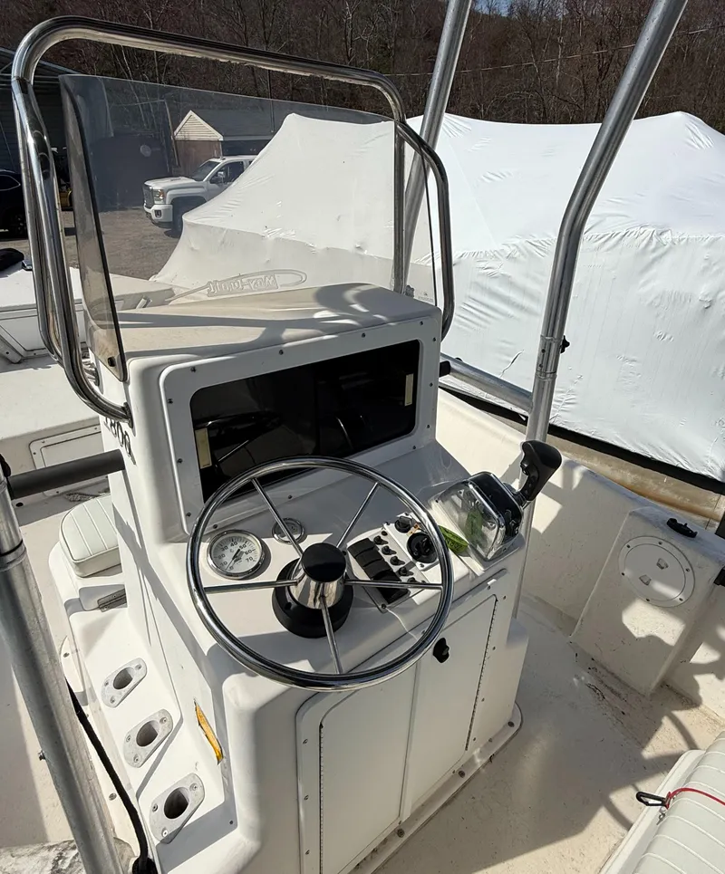 Slide: The Image of 2010 May-Craft 1800 Skiff boat console with steering wheel and gauges. - 7