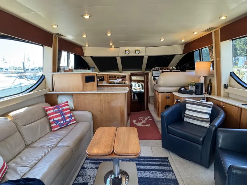 Slide: The Image of Luxurious interior of a 2003 Meridian 381 Sedan yacht with elegant seating and decor. - 13