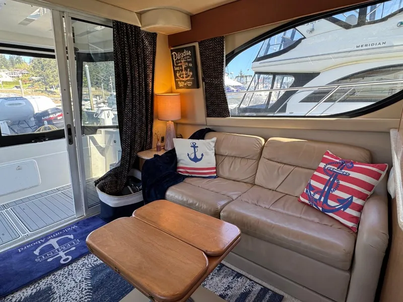 Slide: The Image of Luxurious 2003 Meridian 381 Sedan interior with nautical-themed decor and comfortable seating. - 16