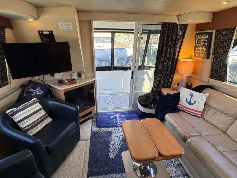 Slide: The Image of Interior of 2003 Meridian 381 Sedan yacht with cozy seating, nautical decor, and modern amenities. - 17