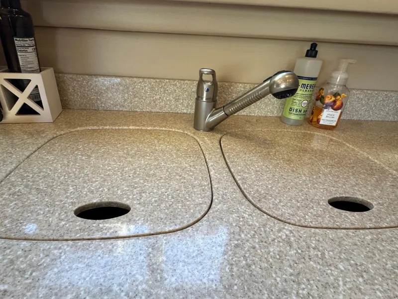 Slide: The Image of Granite countertop with sink covers and faucet in a 2003 Meridian 381 Sedan kitchen. - 24