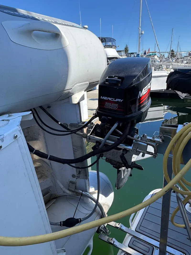 Slide: The Image of Outboard motor on a 2003 Meridian 381 Sedan yacht at a marina. - 3