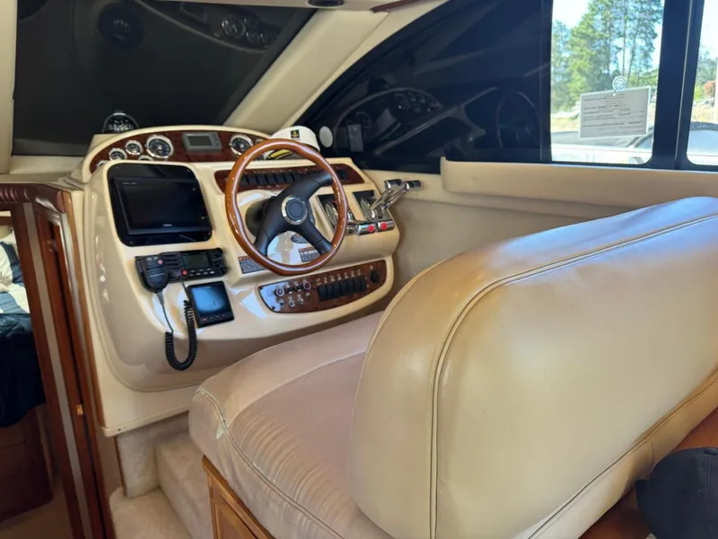 Slide: The Image of 2003 Meridian 381 Sedan helm with beige interior and modern navigation equipment. - 30