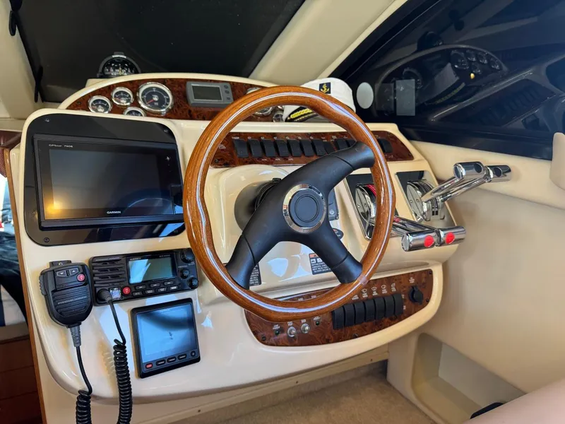 Slide: The Image of Cockpit of 2003 Meridian 381 Sedan with steering wheel and navigation controls. - 31