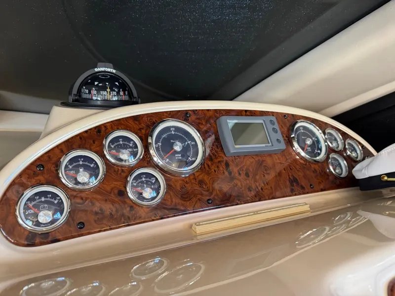 Slide: The Image of Dashboard of a 2003 Meridian 381 Sedan boat with gauges and compass. - 36