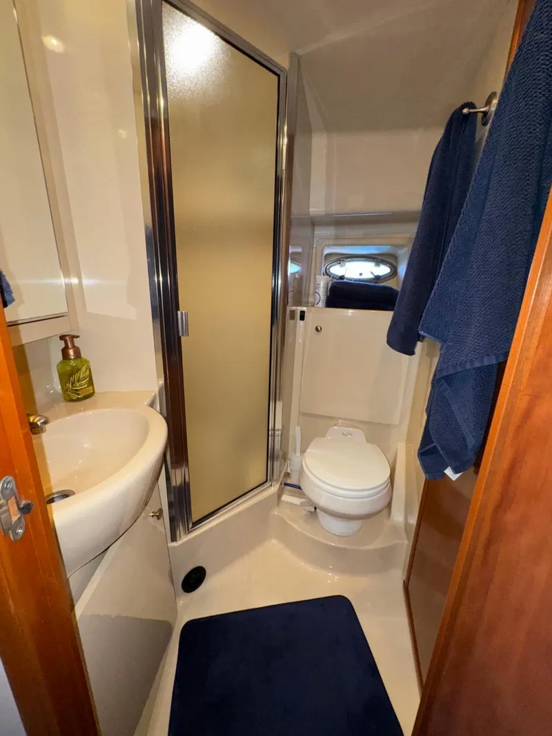 Slide: The Image of 2003 Meridian 381 Sedan bathroom with shower, sink, and toilet. - 38