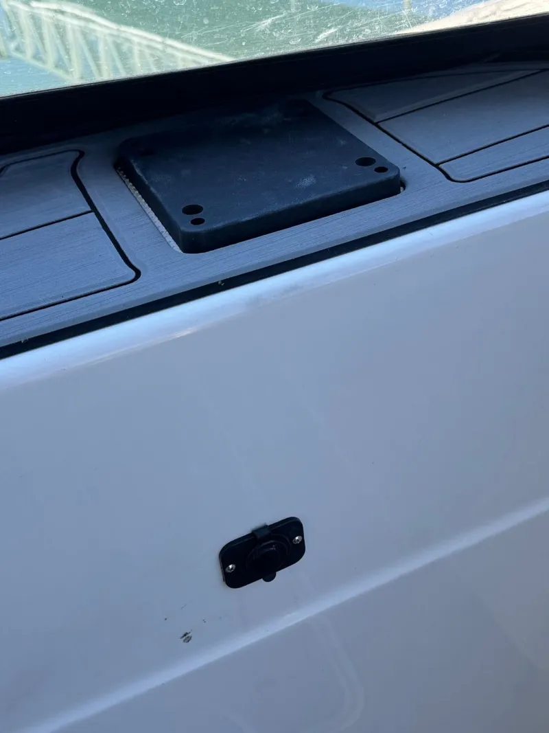 Slide: The Image of 2003 Meridian 381 Sedan boat detail, featuring a sleek white exterior and deck fittings. - 4