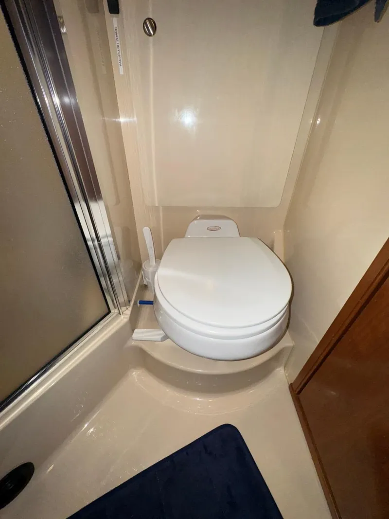 Slide: The Image of 2003 Meridian 381 Sedan bathroom with compact toilet and shower. - 40