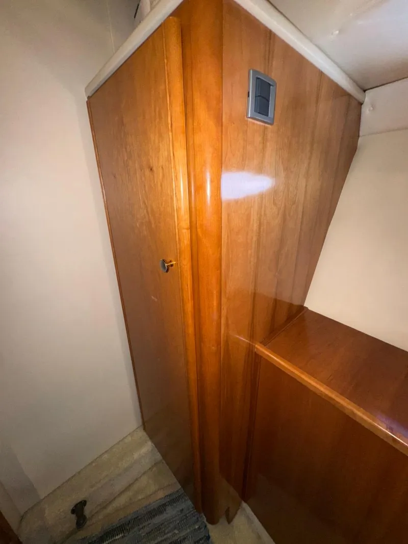 Slide: The Image of Wooden interior of 2003 Meridian 381 Sedan yacht, featuring sleek cabinetry and modern design. - 45