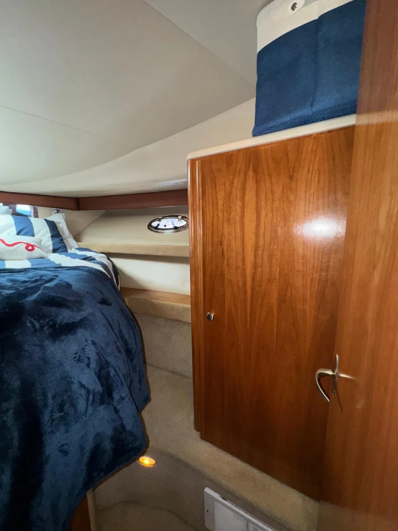 Slide: The Image of Interior cabin of 2003 Meridian 381 Sedan with wooden cabinetry and cozy bedding. - 47