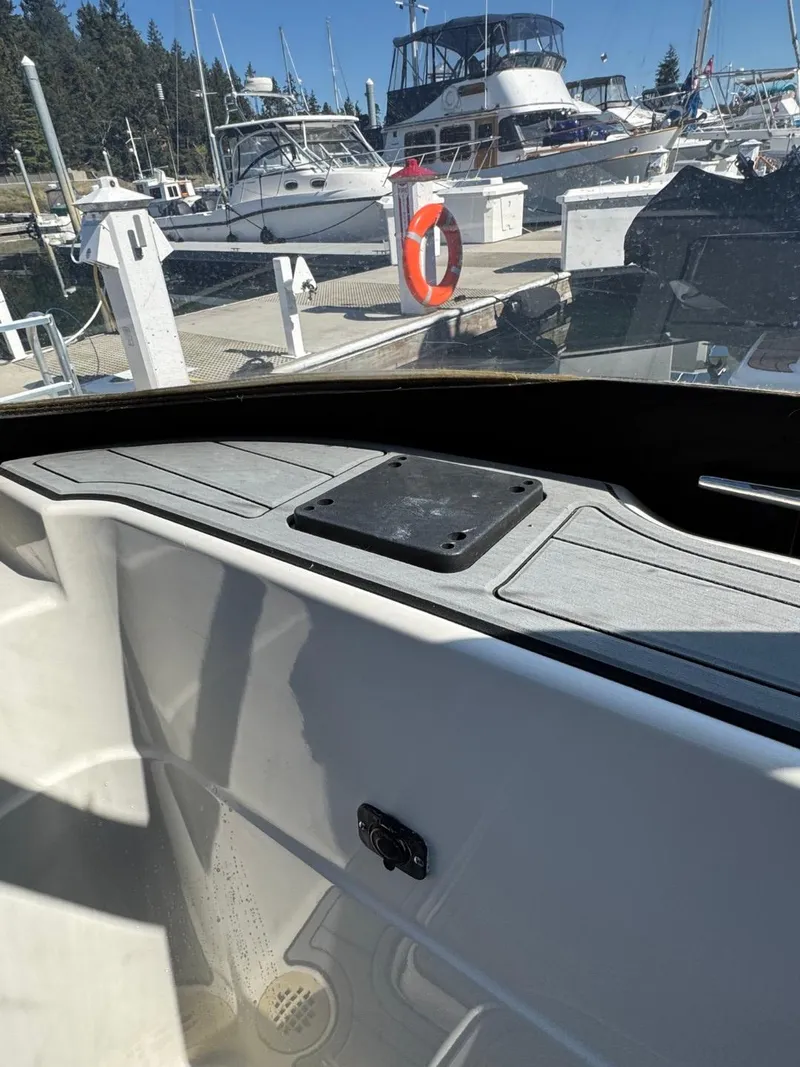 Slide: The Image of 2003 Meridian 381 Sedan interior view at marina, surrounded by boats and clear blue sky. - 7